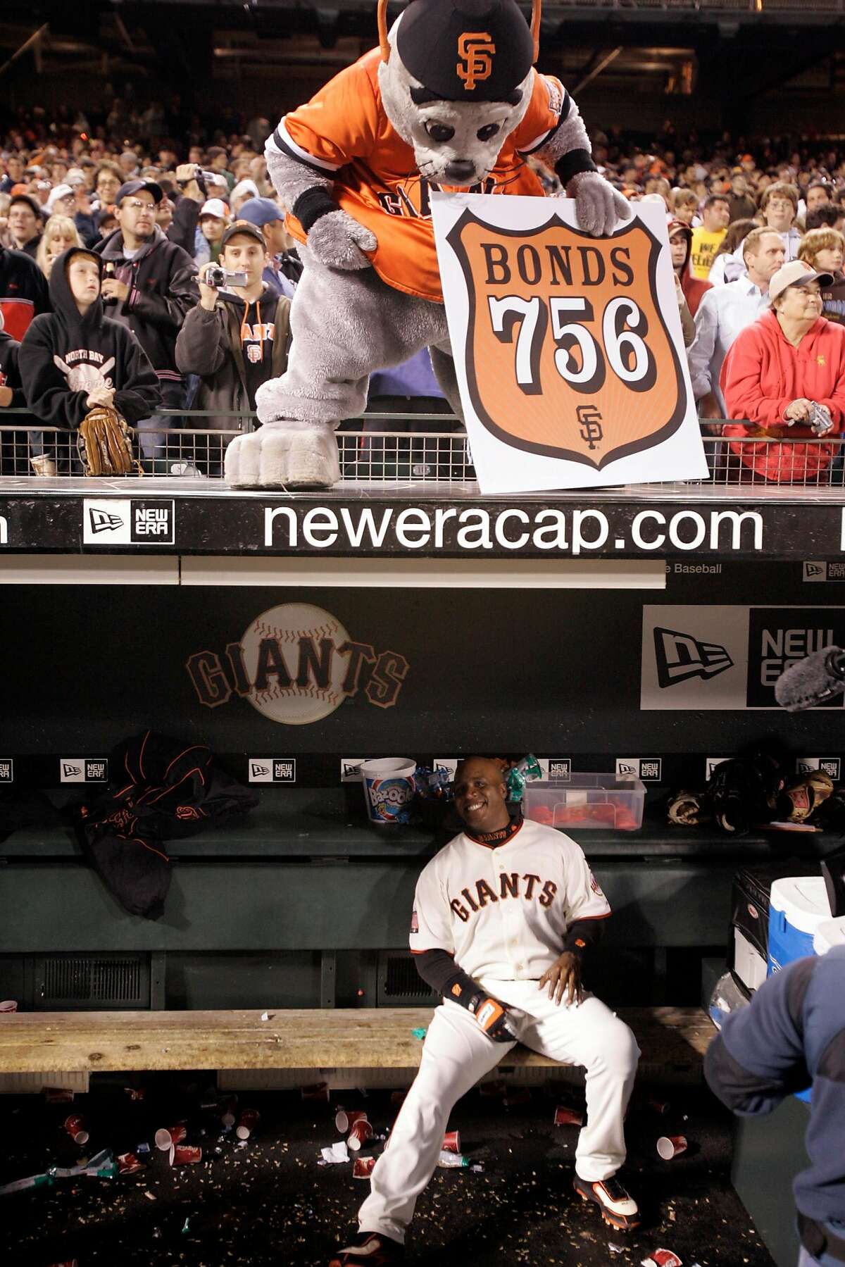 GIANTS07_df_008.JPG Lou Seal looks into the dugout after Barry Bonds hits home run number 756 in the bottom of the fifth inning. Washington Nationals play the San Francisco Giants at AT&T Park in San Francisco, CA, on Tuesday, August 07, 2007. Deanne Fitzmaurice / The Chronicle ** (cq) Ran on: 08-09-2007 Historic swing: Barry Bonds follows through on the swing that sent his 756th home run soaring 435 feet into the center-field bleachers. On contact, there was no question the ball would reach the stands. Bonds knew it and stayed in the batters box, raising both arms as he took his place atop the all-time home run list.