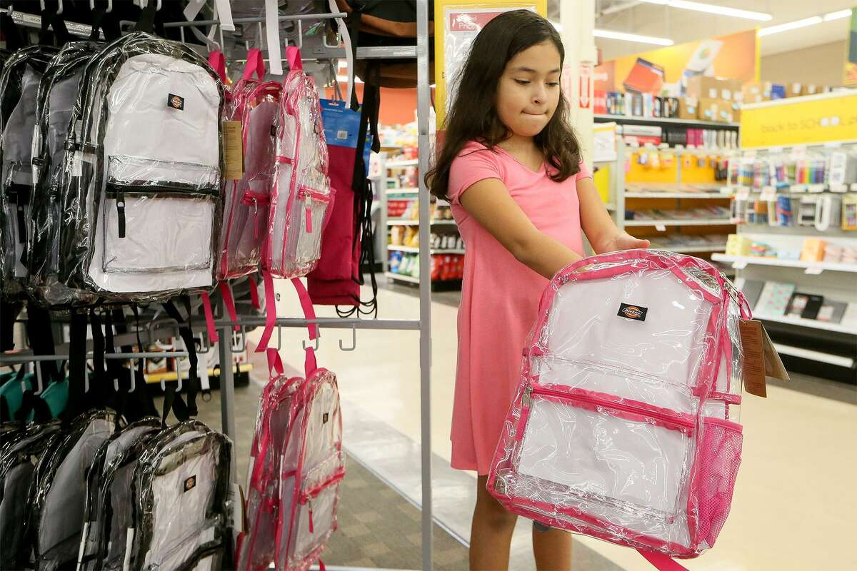 Scarlet Cardenas, a fourth-grader at Bulverde Creek Elemen- tary, shops for a clear backpack at a North Side OfficeMax.