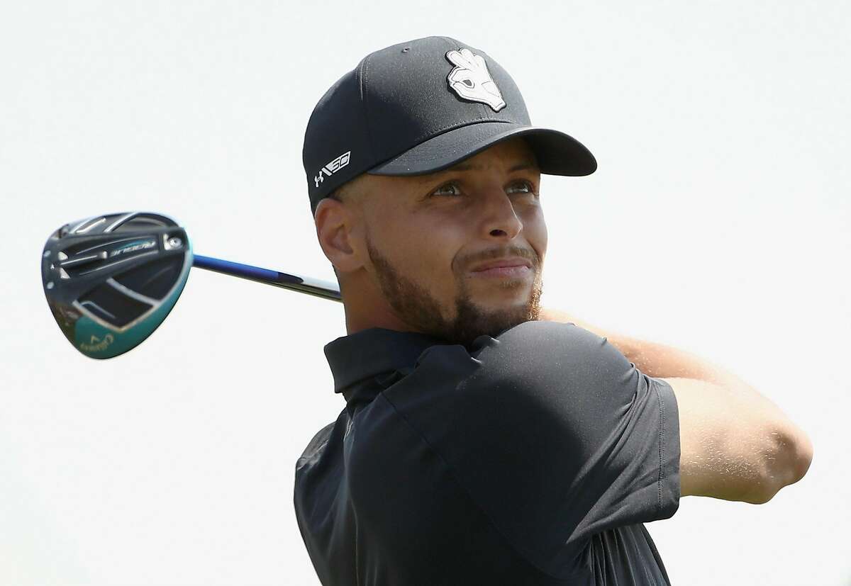 FILE – NBA player Stephen Curry of the Golden State Warriors tees off on the ninth hole during Round One of the Ellie Mae Classic at TBC Stonebrae in this August 9, 2018 file photo taken in Hayward. There are multiple reports that Curry will be partnering with Howard University in Washington, D.C. to relaunch the university's golf program.