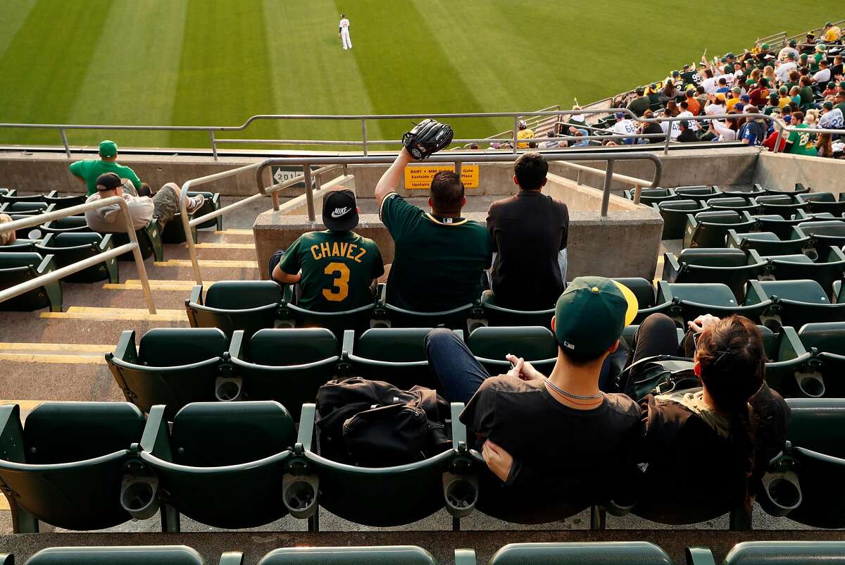 Oakland Athletics' fans watch the A's play Los Angeles Dodgers from right field seats at Oakland Coliseum in Oakland, Calif. on Wednesday, August 8, 2018.