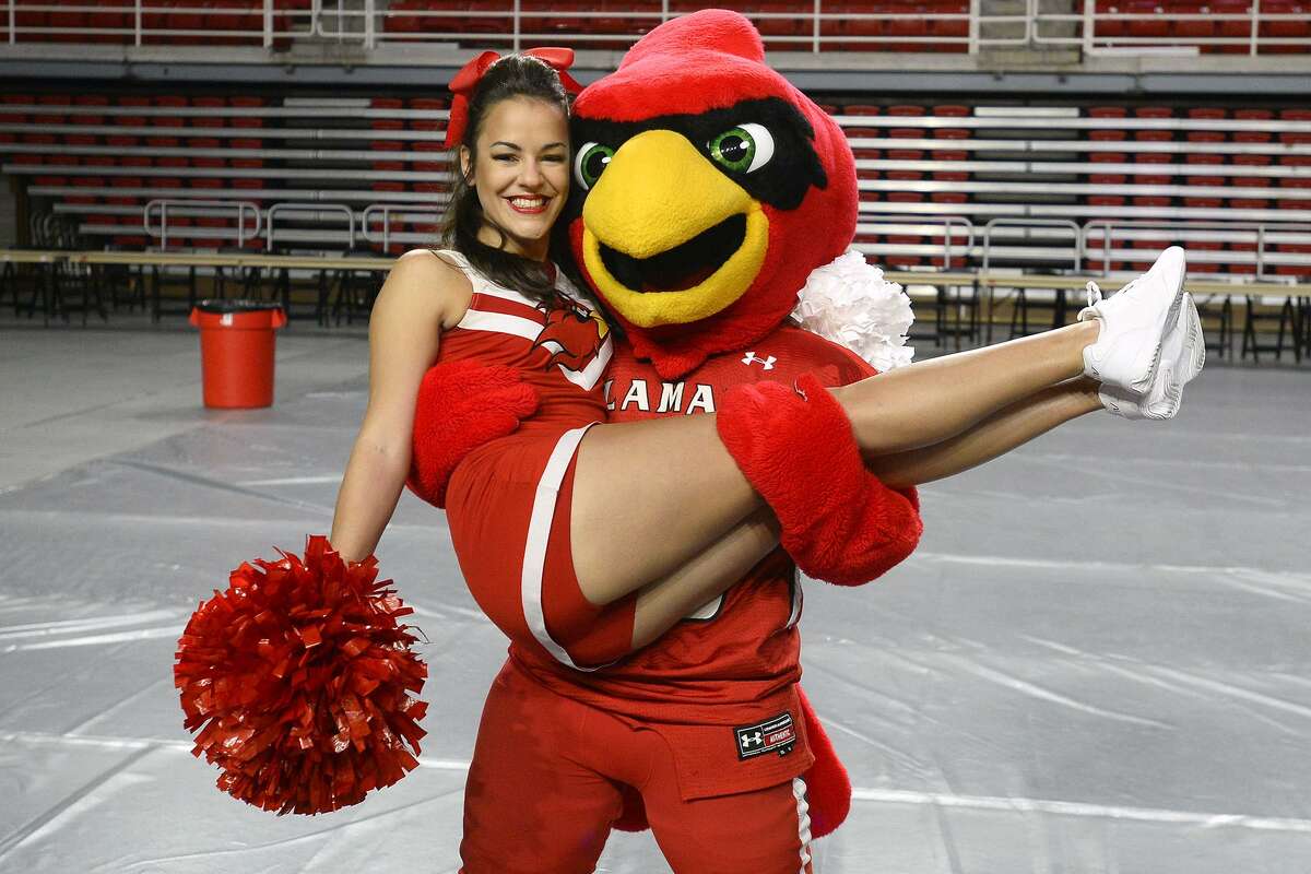 Cheerleader Ally Souza with Big Red during Lamar University's Cardinal Fan Fest at the Montagne Center. The event gave fans an opportunity to get autographs from the school's football, volleyball and women's soccer teams. Photo taken Thursday 8/9/18 Ryan Pelham/The Enterprise