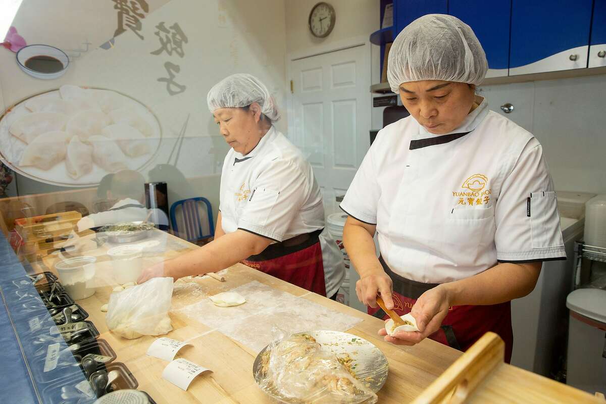 From left: Ms. Zhen and Ms. Zheng make dumplings at Yuanbao Jiaozi, Saturday, Aug. 4, 2018, in San Francisco, Calif. The Chinese restaurant is located at 2110 Irving St.