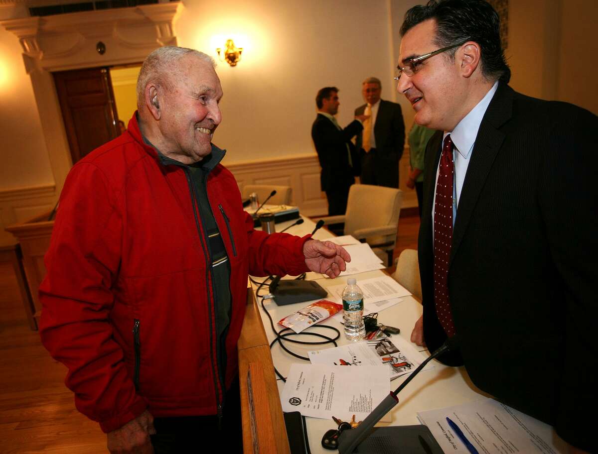 Joseph Prisco, left of Milford, chats with Minority Leader Anthony Giannattasio before a Milford Board of Aldermen meeting