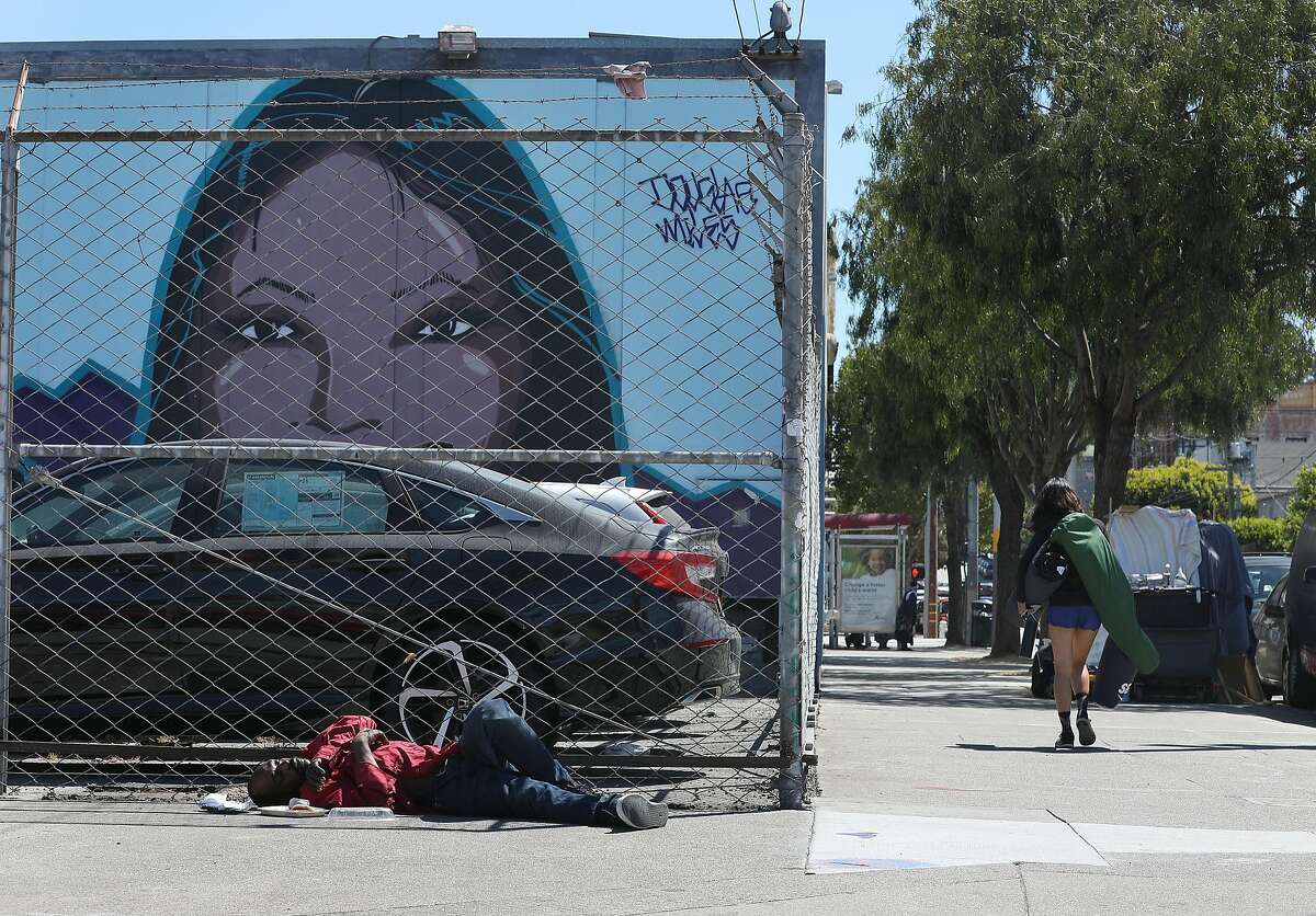 Man sleeping on Shotwell at 16 streets seen on Monday, Aug. 6, 2018 in San Francisco, Calif. Two years after they were shot to death in the box they lived in at a homeless camp on Division Street, there have been no arrests and the homeless camp no longer exists.