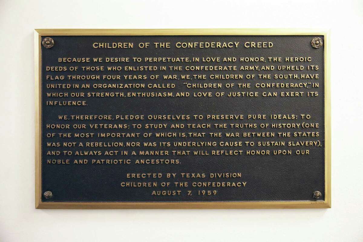 A plaque stating the Children of the Confederacy Creed is positioned in a narrow hallway just outside the main concourse of the Capitol rotunda on Aug. 17, 2017.