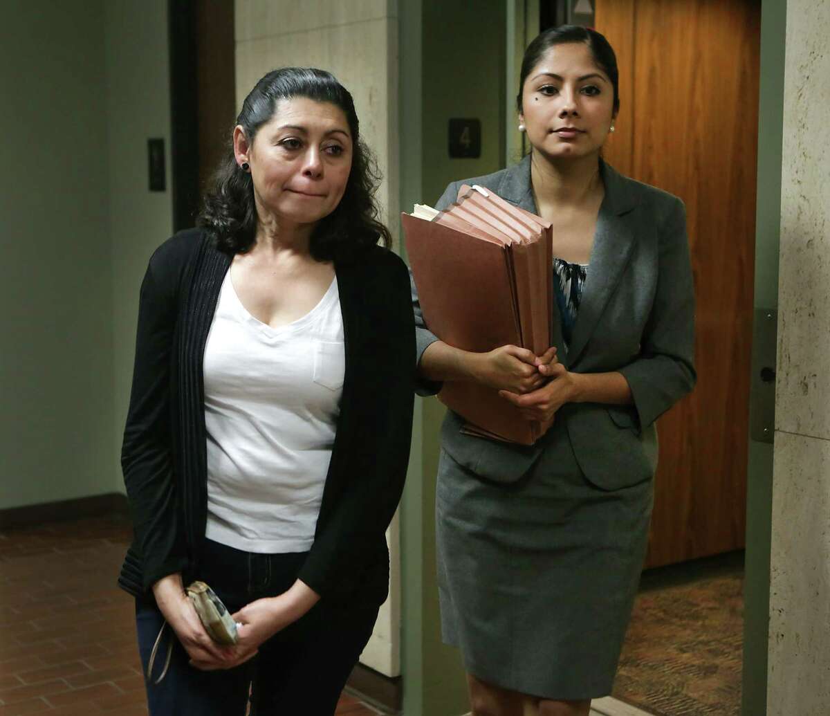 A distraught Lesly Cabrera, left, walks with Claudia Hernandez, her lawyer, following the judges decision in immigration court. Cabrera, a Honduran mother who is seeking asylum here due to gang violence aimed at her 17 year-old son while they were in San Pedro Sula, was denied application to asylum on May 18, 2015. Rejection will be more common with Attorney General Jeff Sessions’ decision to remove fear of domestic or gang violence as reasons to grant asylum.