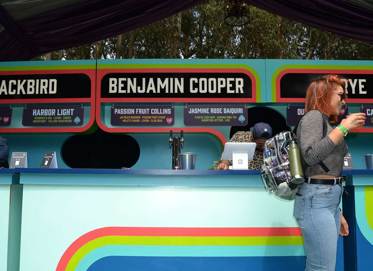Bartenders at Cocktail Magic pour drinks for Outside Lands Music Festival attendees on August 10, 2018.