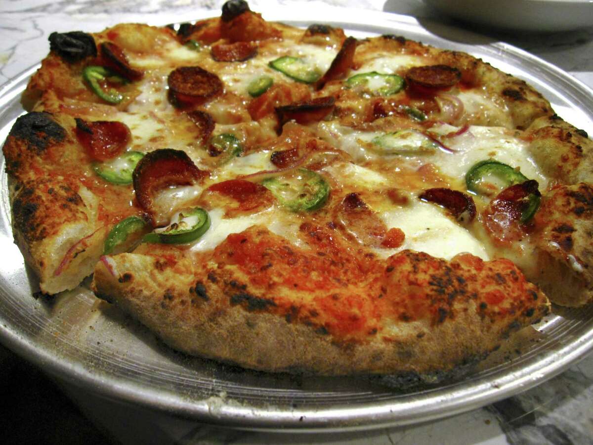 A sourdough pizza with pepperoni and jalapeños from Playland, the new pizza project on East Houston Street from restaurateur Andrew Goodman and chef Stefan Bowers.