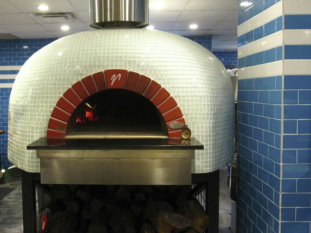 The massive 3,500-pound, wood-burning Mugnaini pizza oven at Playland.