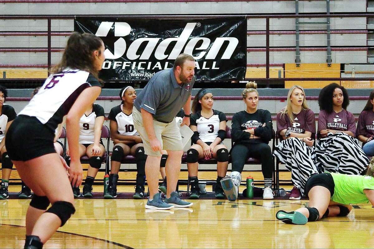 Pearland volleyball coach Christian Dunn watches his team play Granbury Thursday in the John Turner Classic.