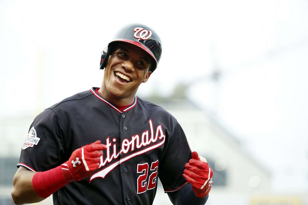 Washington Nationals' Juan Soto celebrates after his solo home run during the first inning of the second baseball game of a doubleheader against the Atlanta Braves at Nationals Park, Tuesday, Aug. 7, 2018, in Washington.(AP Photo/Alex Brandon)