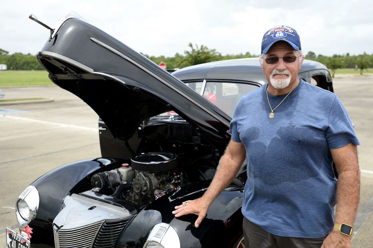 Dana Braquet, of Hamshire, with his 1940 Ford Deluxe Fordor during a car show to collect school supplies to donate to children in need at the Thomas Center. This is the second year the Brown Impressions Lowrider Car Club has hosted the event. Photo taken Saturday 8/11/18 Ryan Pelham/The Enterprise