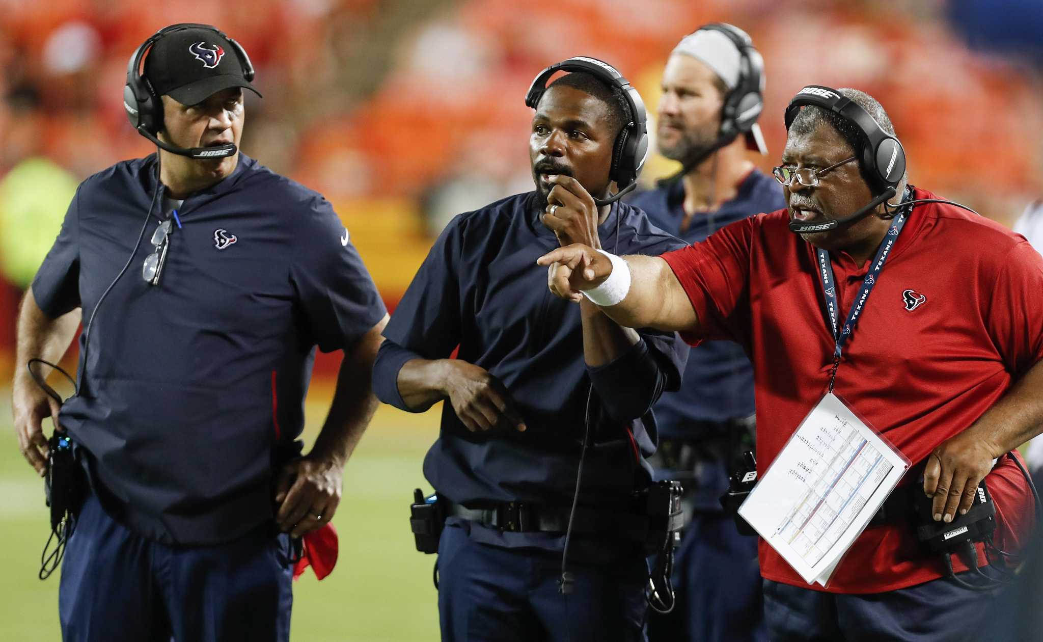 Texans' Romeo Crennel not ready to flash Super Bowl rings yet