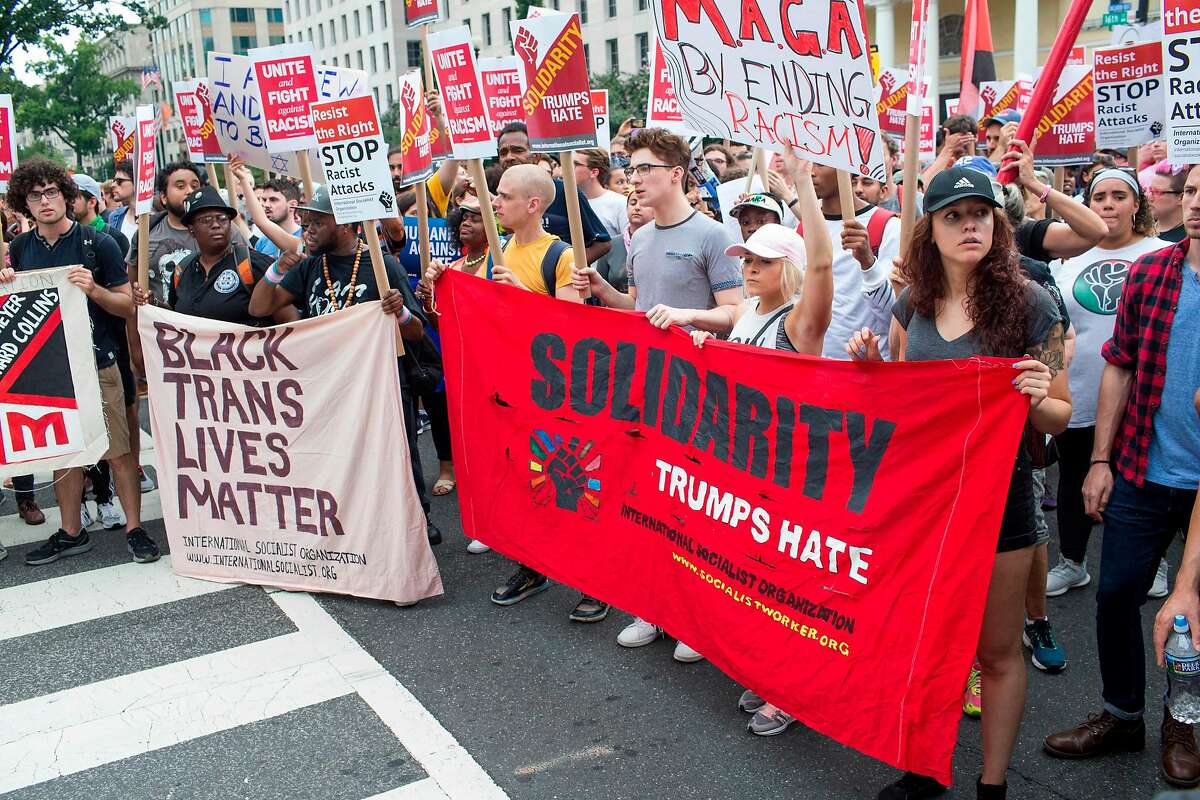 Counter protestors to a far-right rally march during the Unite the Right 2 Rally in Washington, DC, on August 12, 2018. - Last year's protests in Charlottesville, Virginia, that left one person dead and dozens injured, saw hundreds of neo-Nazi sympathizers, accompanied by rifle-carrying men, yelling white nationalist slogans and wielding flaming torches in scenes eerily reminiscent of racist rallies held in America's South before the Civil Rights movement. (Photo by ZACH GIBSON / AFP)ZACH GIBSON/AFP/Getty Images