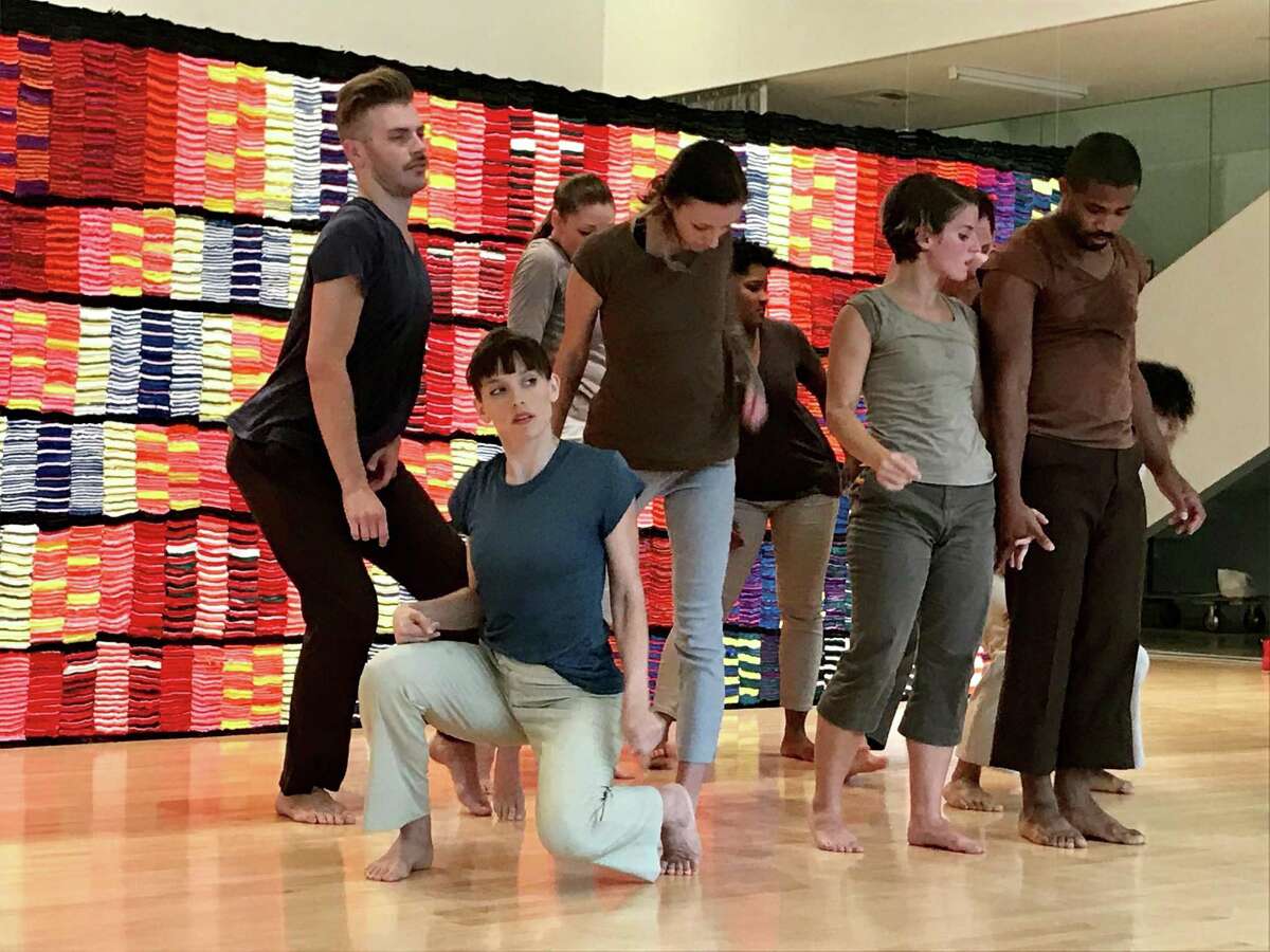 Members of Hope Stone Dance Company in the premiere of Jane Weiner’s “coolest news on planet earth, chapter 2” at Moody Center for the Arts. The piece was inspired by the art installation “Crepe Paper Carpet,” which also serves as a backdrop.