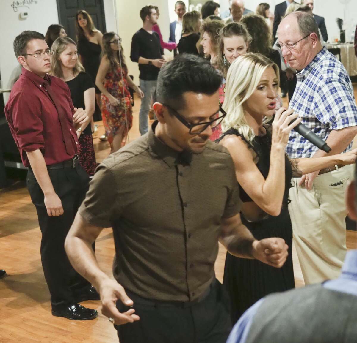 JK Dance Center owner Kelsey Tanner and Dancing with the Stars dance friend Paul Barris lead a group class 08/10/18 evening during the grand opening of the dance center. Tim Fischer/Reporter-Telegram