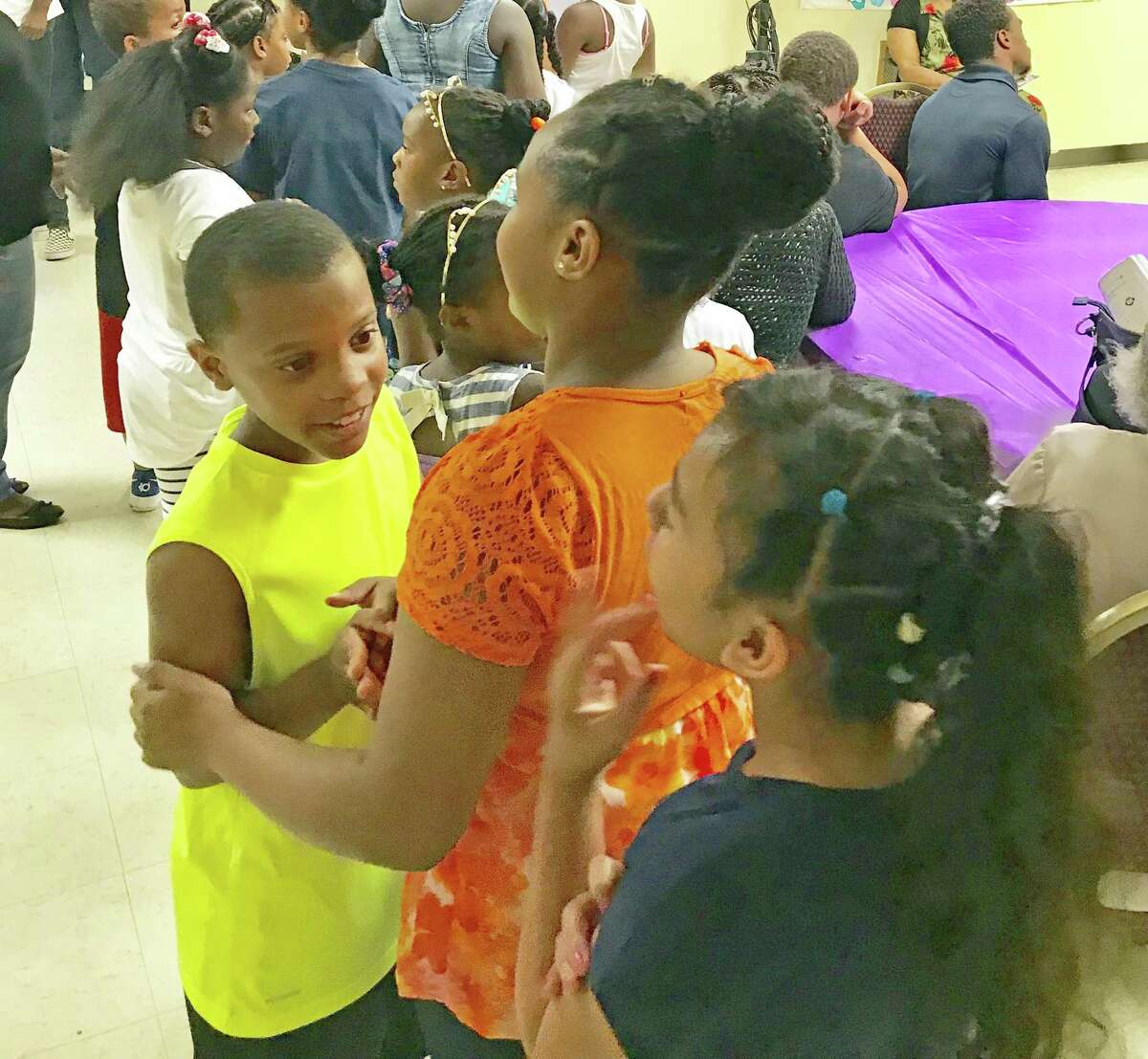 Shiloh Missionary Baptist Church recently collected over 100 book bags filled with school supplies in Middletown. Here, eager children queue up in line.