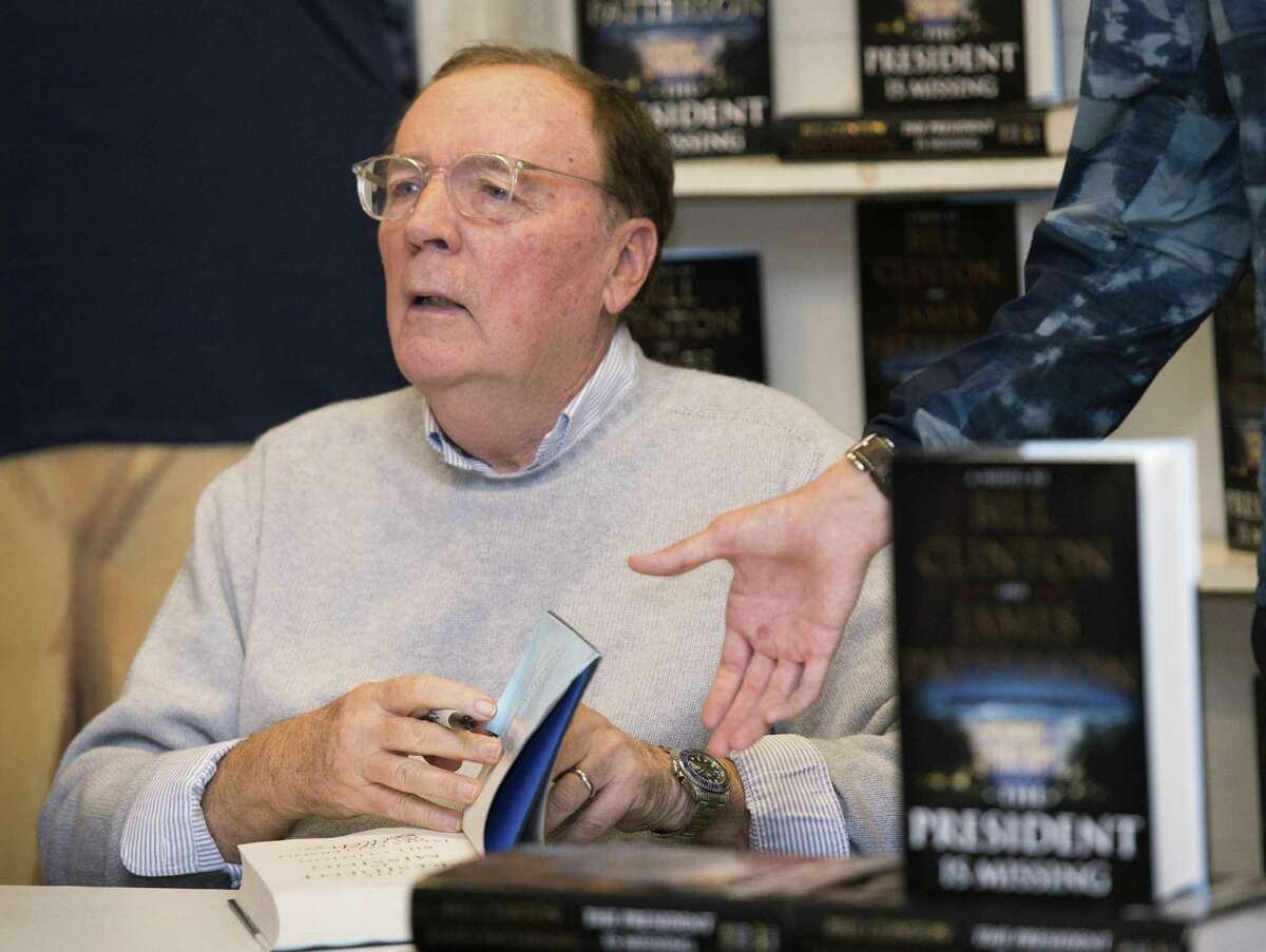 Author James Patterson signs copies of “The President is Missing.”