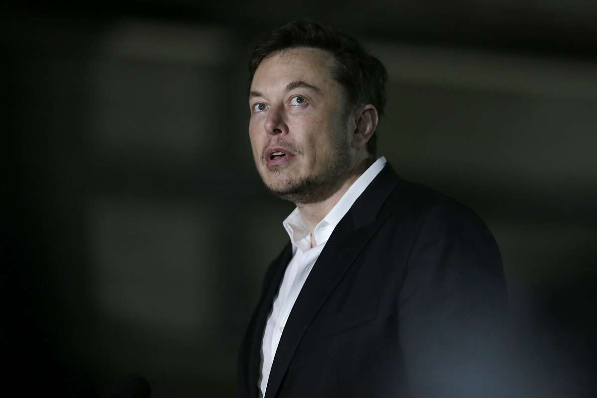 FILE- In this June 14, 2018, file photo Tesla CEO and founder of the Boring Company Elon Musk speaks at a news conference. On Thursday, Aug. 9, Tesla shares have dropped back to near the level they were trading at before Musk tweeted Tuesday that he may take the company private. (AP Photo/Kiichiro Sato, File)