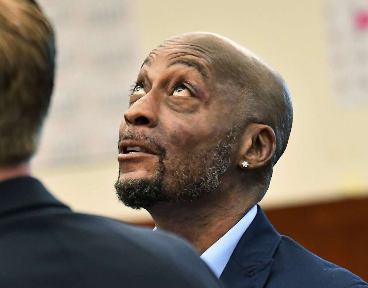 FILE - In this July, 9, 2018, file photo, plaintiff DeWayne Johnson looks up during a brief break as the Monsanto trial in San Francisco. Monsanto is being accused of hiding the dangers of its popular Roundup products. A San Francisco jury on Friday, Aug. 10, 2018, ordered agribusiness giant Monsanto to pay $289 million to a former school groundskeeper dying of cancer, saying the company's popular Roundup weed killer contributed to his disease. The lawsuit brought by Johnson was the first to go to trial among hundreds filed in state and federal courts saying Roundup causes non-Hodgkin's lymphoma, which Monsanto denies. (Josh Edelson/Pool Photo via AP, File)