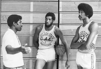 Coach Al Attles talks to the two centers (Clifford Ray, left, and George Johnson) in 1974. Ray and Johnson would replace long-time Warrior Nate Thurmond.