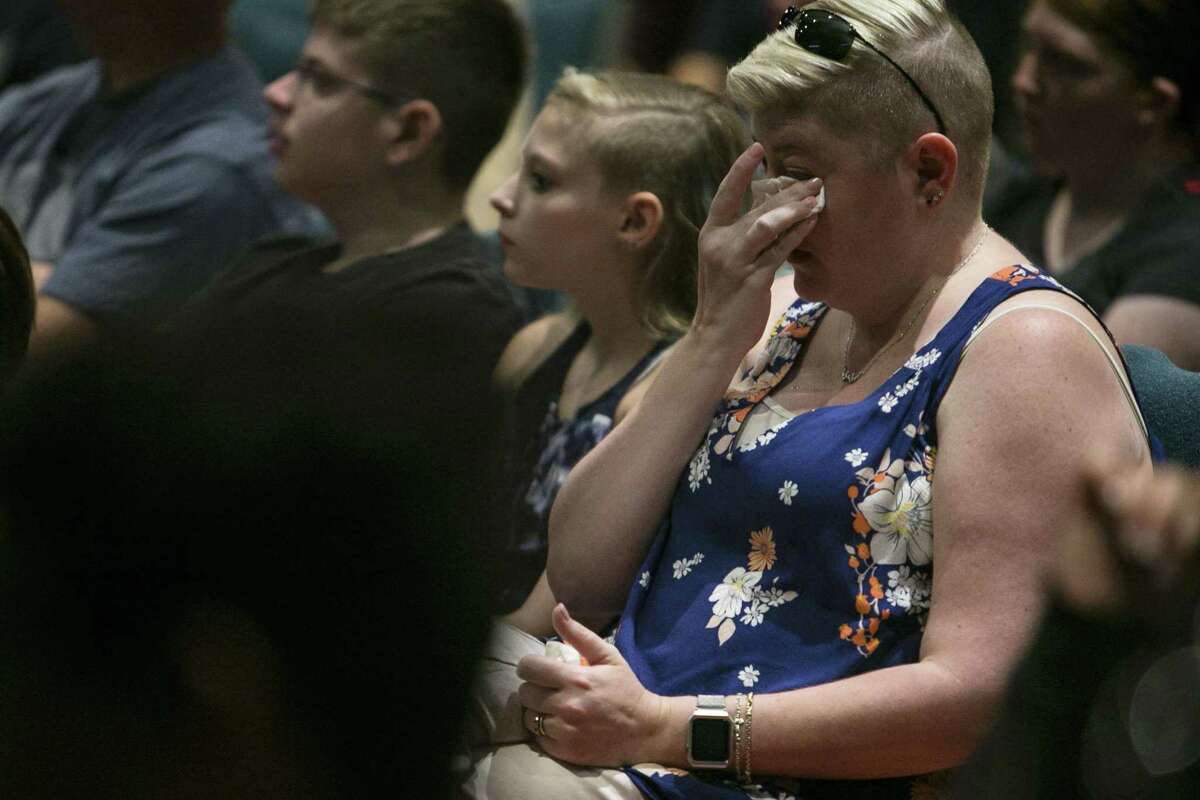 Overcome with emotion as mass shooting case studies are reviewed, Ann Small wipes away tears Monday.