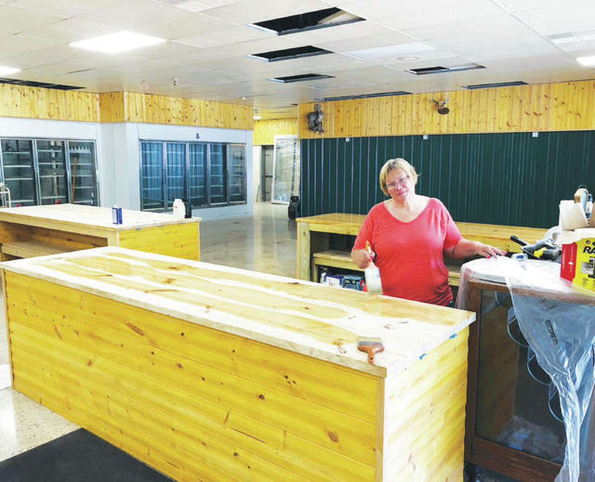 Grafton Market co-owner Susan Loemker works on renovations to the new store. Loemker and co-owner Scott Myers renovated the nearly 1,500 square feet of Grafton Market’s space at 1415 W. Main St.