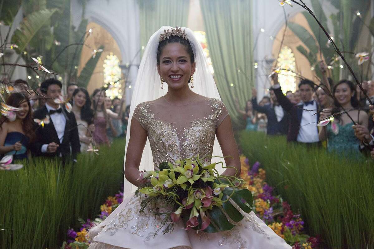 This image released by Warner Bros. Entertainment shows Sonoya Mizuno in a scene from the film "Crazy Rich Asians." (Sanja Bucko/Warner Bros. Entertainment via AP)