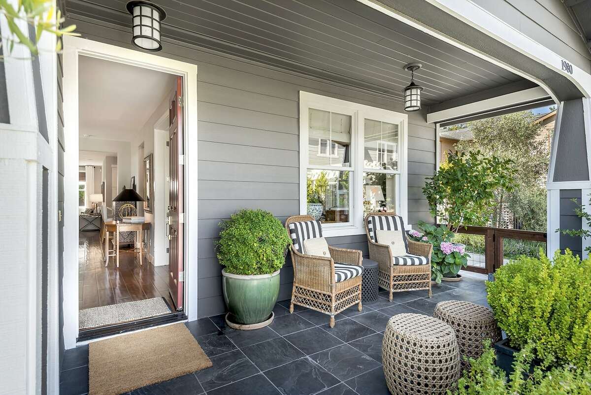 A covered tile porch stretches before the Yountville home.