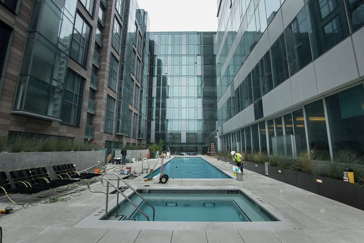 A swimming pool infills the open space between 150 Van Ness and 100 Van Ness on Tuesday, Aug. 14, 2018 in San Francisco, CA.