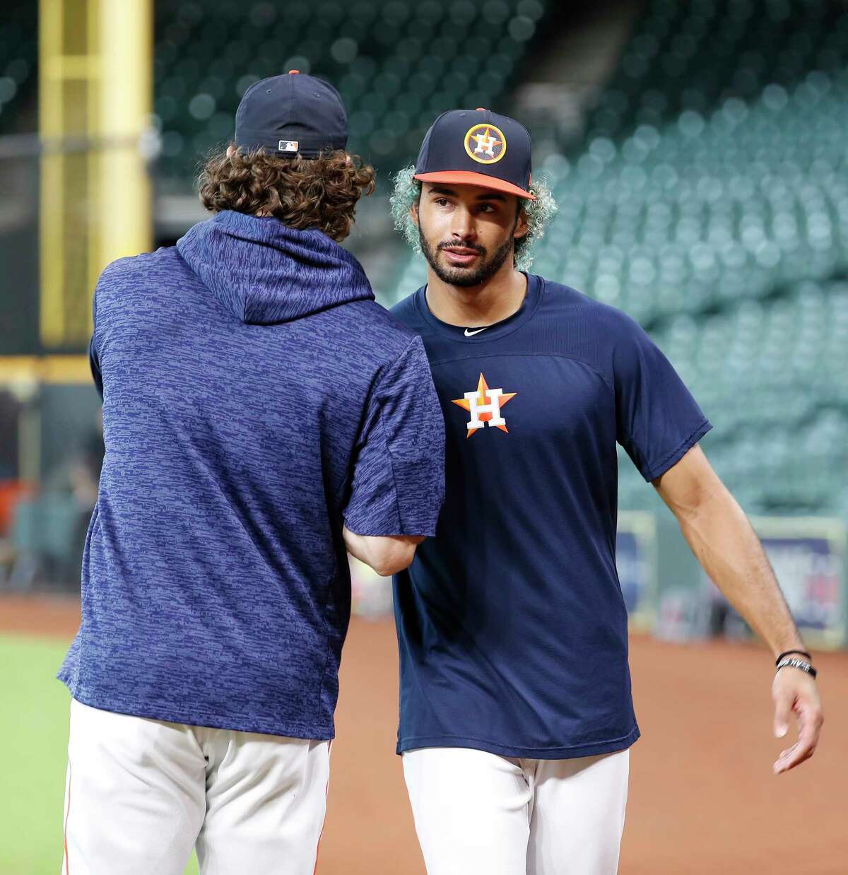 Dante Pettis, son of Houston Astros third base coach Gary Pettis, who was the second round draft pick for the San Francisco 49ers greets pitcher Gerrit Cole during batting practice before the start of an MLB game at Minute Maid Park, Tuesday, August 14, 2018, in Houston.