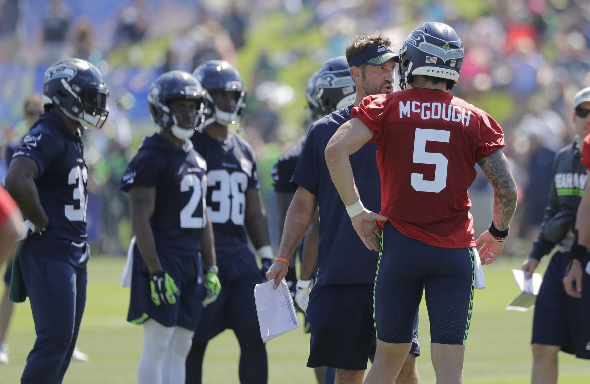 Seattle Seahawks quarterback Alex McGough (5) scrambles with the