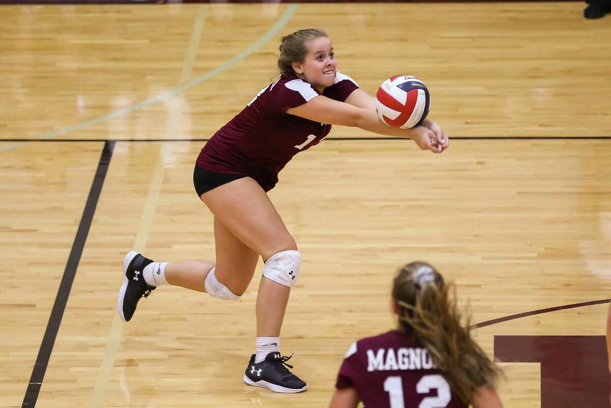 Magnolia's Lily Dalton (13) digs the ball during the volleyball game against Klein Collins on Tuesday, Aug. 14, 2018, at Magnolia High School.