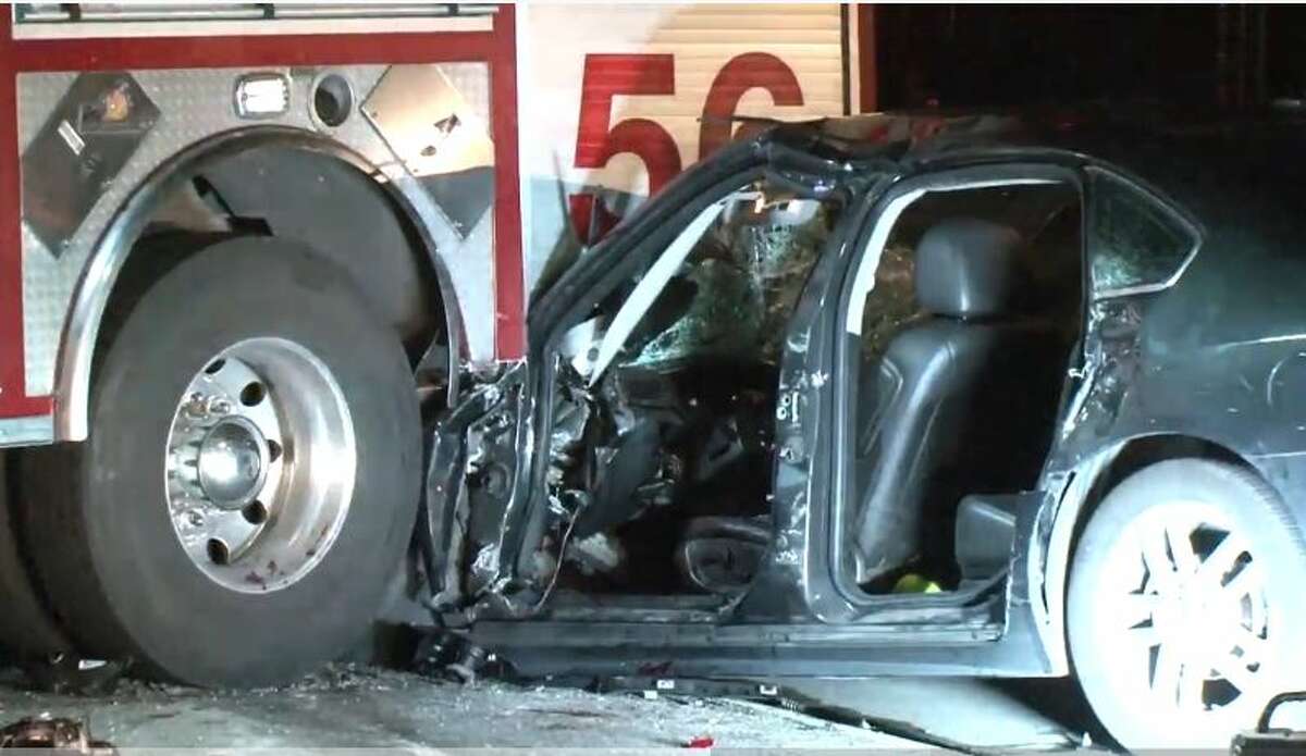 Driver slams into HFD fire truck, gets trapped in crushed car
