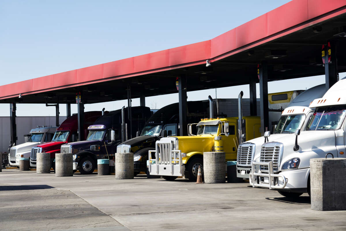 18-wheelers fuel up with diesel at a truck stop in California.