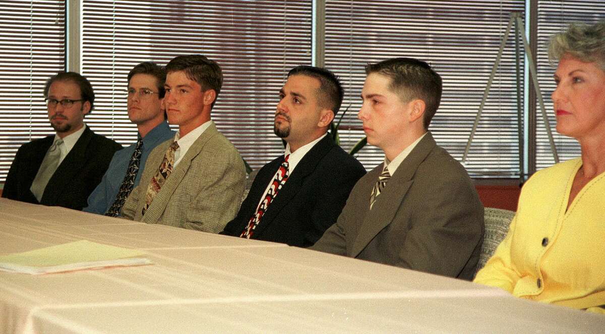 FILE— Plaintiffs, Shown from left are: James Sibert; Wade Schlossstein; Nathan Nichols; Tracy Lemoine; Nick Porter; and Nancy Lemberger, mother of Pat Lemberger, during a news conference about the Rudy Kos civil case settlement Friday, July 10, 1998, in Dallas.