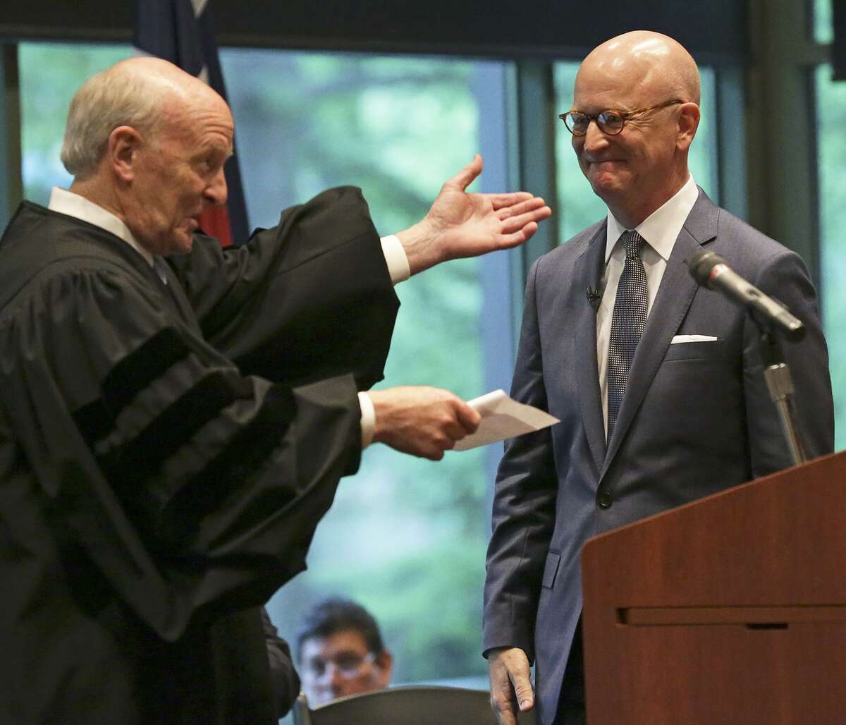 In this 2015 photo, U.S. District Judge Fred Briery (left) presents U.S. District Judge Robert Pitman following a swearing in ceremony. Biery is presiding over a rancorous civil case involving Quicken Loans and HouseCanary. HouseCanary won a record $706 million jury verdict against a Quicken Loan affiliate early this year in Bexar County.