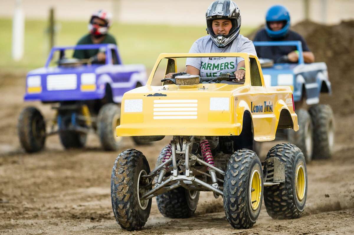 Volunteers race ATVs during a monster truck rally on Wednesday, August 15, 2018 at the Midland County Fairgrounds. (Katy Kildee/kkildee@mdn.net)