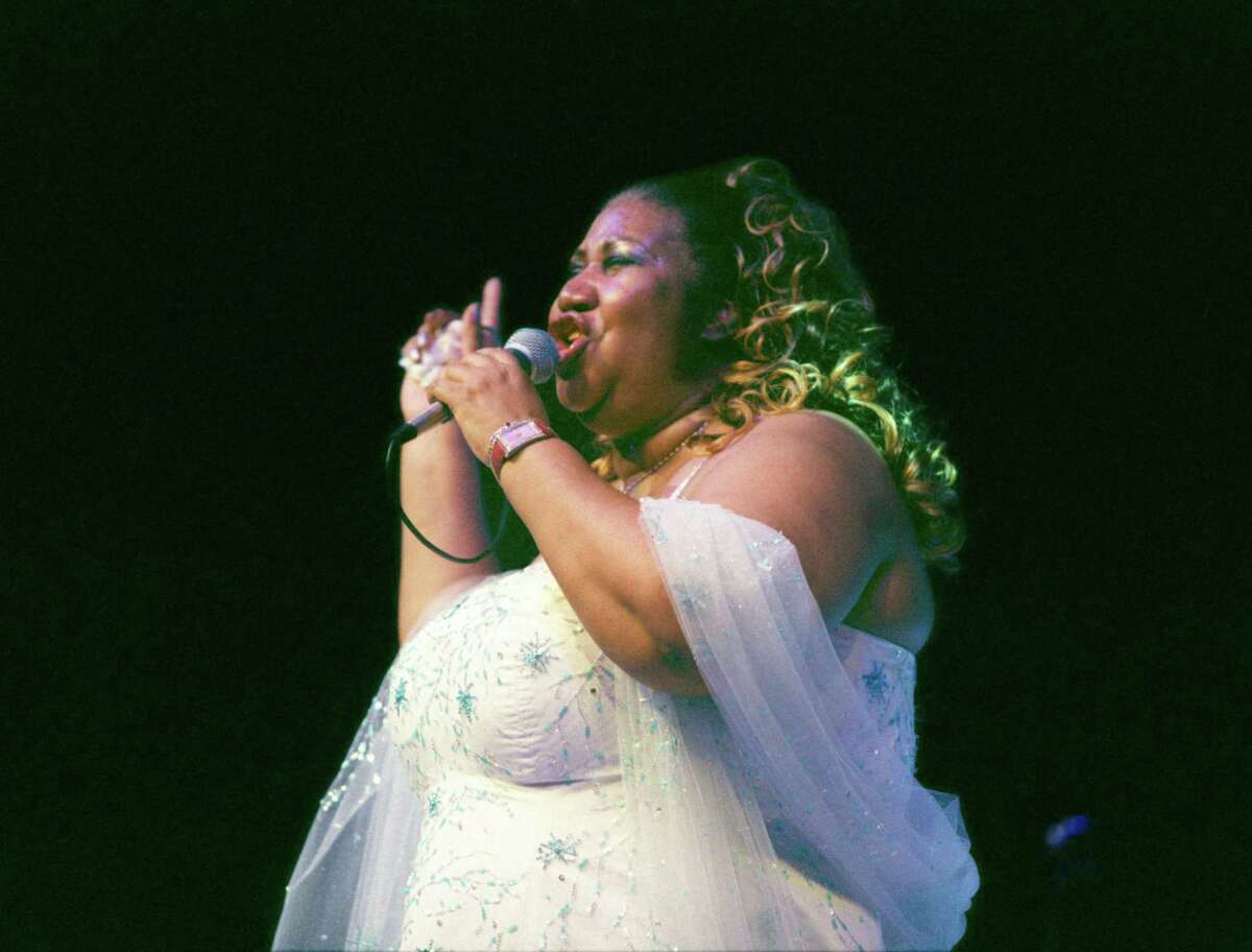 Aretha Franklin performs at the Arena Theater in Houston in October 2002. 