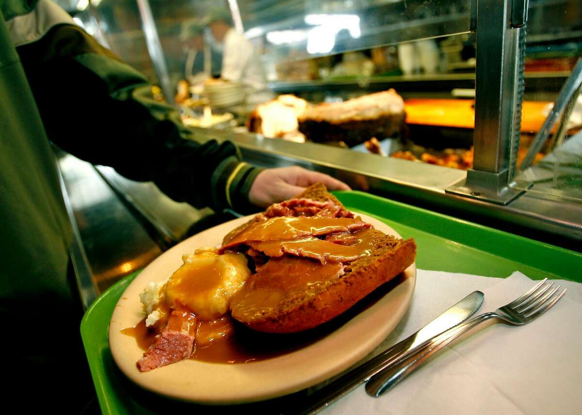 BARGAIN08_BRENNANS_8590.JPG Jeff Johnson from Berkeley walks down the counter with his open face corn beef sandwich. Berkeley's Brennan's at the foot of University Ave is one of the few remaining true hofbrau-style joints - big slabs of meat cut to order from freshly roasted sides of beef, turkey, etc. Then the plate gets a scoop of mashed potatoes, ladles full of gravy, steamed vegetables and a roll - all for fewer than 10 bucks. Also, humongous sandwiches are made to order. February 28, 2007.BERKELEY.By Lance Iversen/San Francisco Chronicle Ran on: 03-08-2007 Brennans, top, at the foot of University Avenue, is blue-collar Berkeley, where slabs of meat, such as this corned beef sandwich, above, reign. Also in abundance are TVs, so that customers can catch the latest football or hockey games.