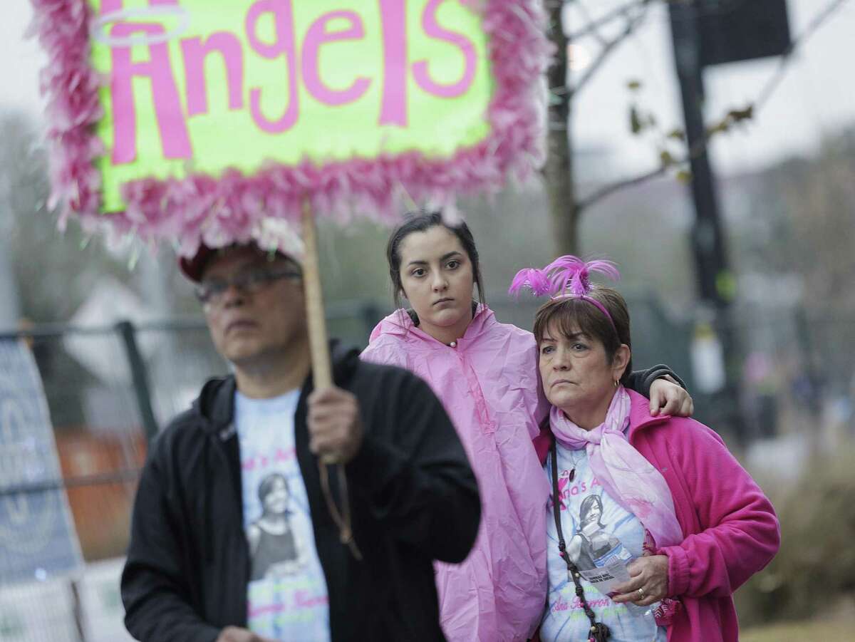 Participants listen to the singing of Amazing Grace before the Susan G. Koman Race for the Cure on Saturday, Jan. 27, 2018, in Houston. The event, which is traditionally in October, was rescheduled because of Harvey. ( Elizabeth Conley / Houston Chronicle )