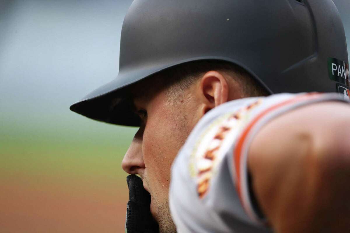 LOS ANGELES, CA - APRIL 01: Joe Panik #12 of the San Francisco Giants looks on from the dugout during the third inning of the MLB game against the Los Angeles Dodgers at Dodger Stadium on April 1, 2018 in Los Angeles, California. The Dodgers defeated the Giants 9-0. (Photo by Victor Decolongon/Getty Images)