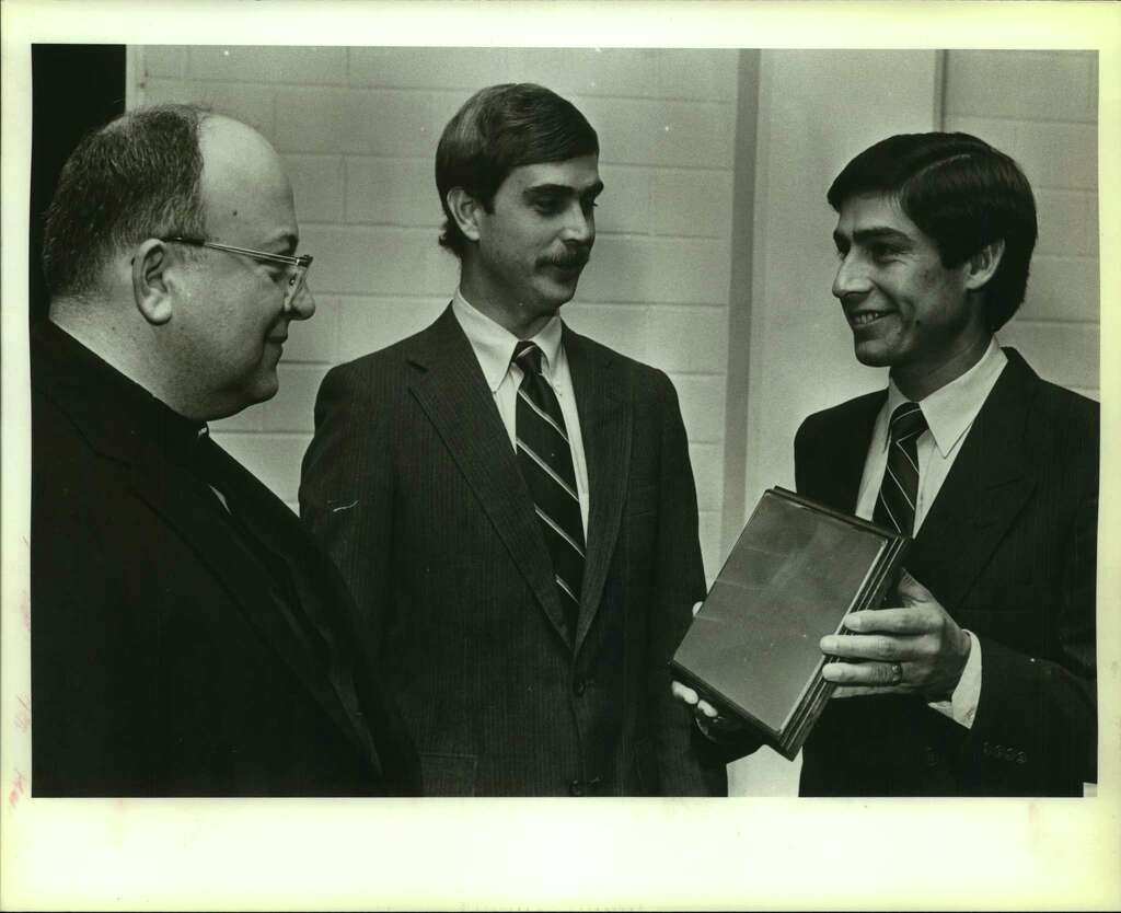This undated San Antonio Express-News file photo shows the Rev. David Connell (left) receiving an Outstanding Alumni Award at Antonian College Preparatory High School. Connell was accused in the Pennsylvania grand jury report of drugging and raping a minor on at least two occasions. Photo: Charles Barksdale, San Antonio Express-News / San Antonio Express-News