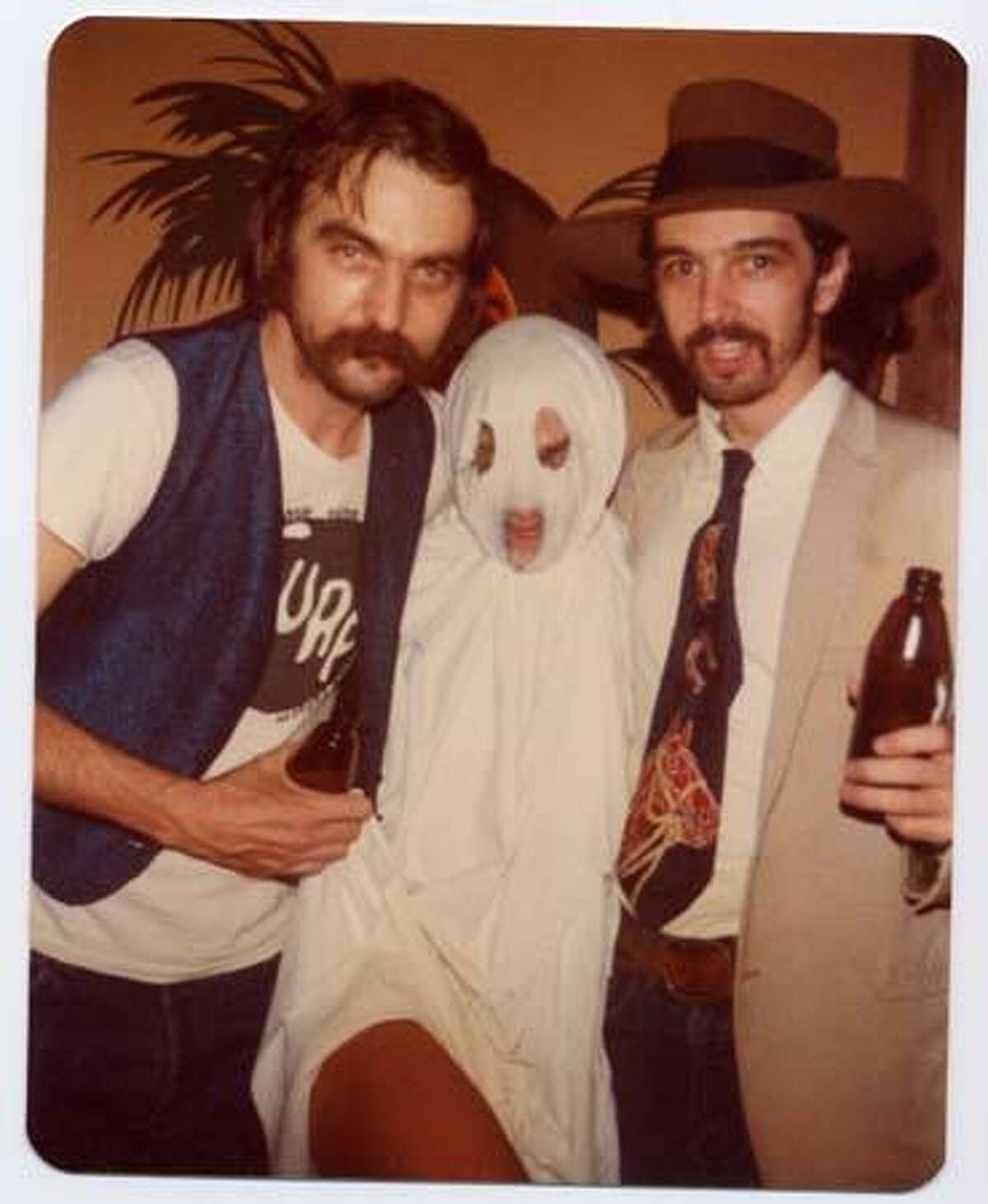 Blaze Foley with Gurf Morlix and unknown ghost on Halloween. Gurf and Blaze dressed up as each other.