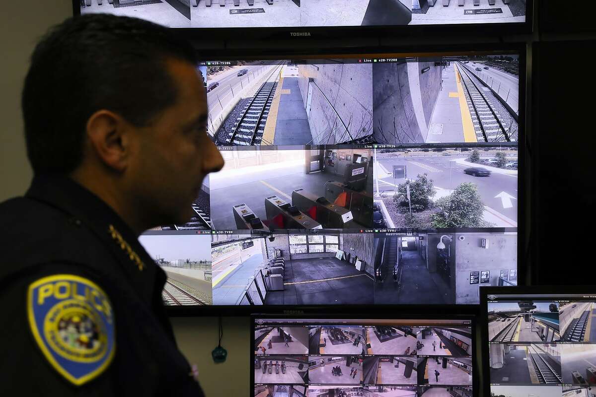 BART Police Chief Carlos Rojas stands in front of monitors displaying live images from multiple BART train stations, as he discusses the fatal stabbing of Nia Wilson, which occurred at the MacArthur BART station last Sunday, inside the video recovery room at BART Police Headquarters in Oakland, Cali. on Thursday, July 25, 2018.