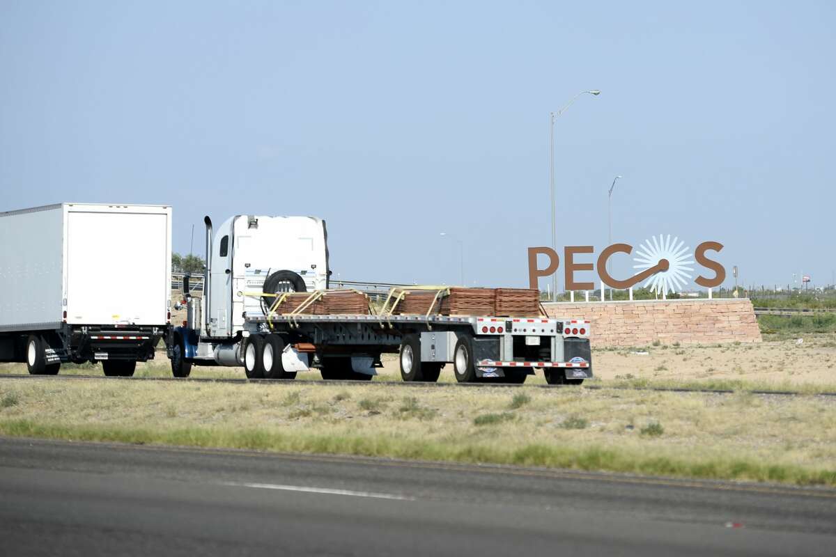 Heavy truck traffic passes through Pecos July 31, 2018. James Durbin/Reporter-Telegram