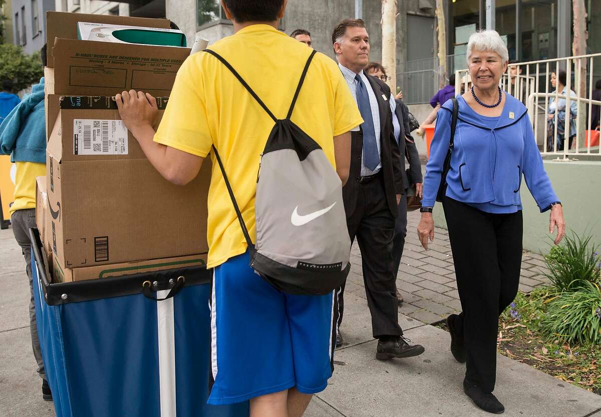 UC Berkeley Chancellor Carol Christ walks by new students and parents as they haul belongings into the Unit 1 Residential Hall during move-in day at the dorms in Berkeley, Calif. Tuesday, Aug. 14, 2018.