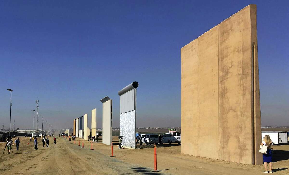 Prototypes of border walls in San Diego. President Donald Trump says he has secured $3.2 billion for his promised border wall. But so far Congress has given him only $1.6 billion, and most of that was to replace existing barriers and make other security enhancements. (AP Photo/Elliott Spagat, File)