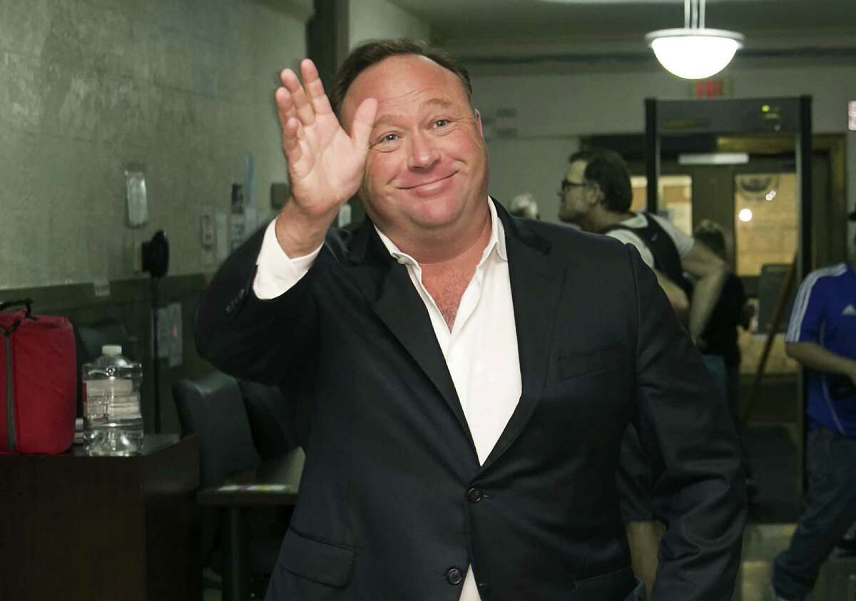 Alex Jones, a right-wing radio host and conspiracy theorist, arrives at the courthouse in Austin in 2017. YouTube, Facebook, Spotify and other sites are finding themselves in a role they never wanted, as gatekeepers of discourse on their platforms, deciding what should and shouldn't be allowed and often angering almost everyone in the process.