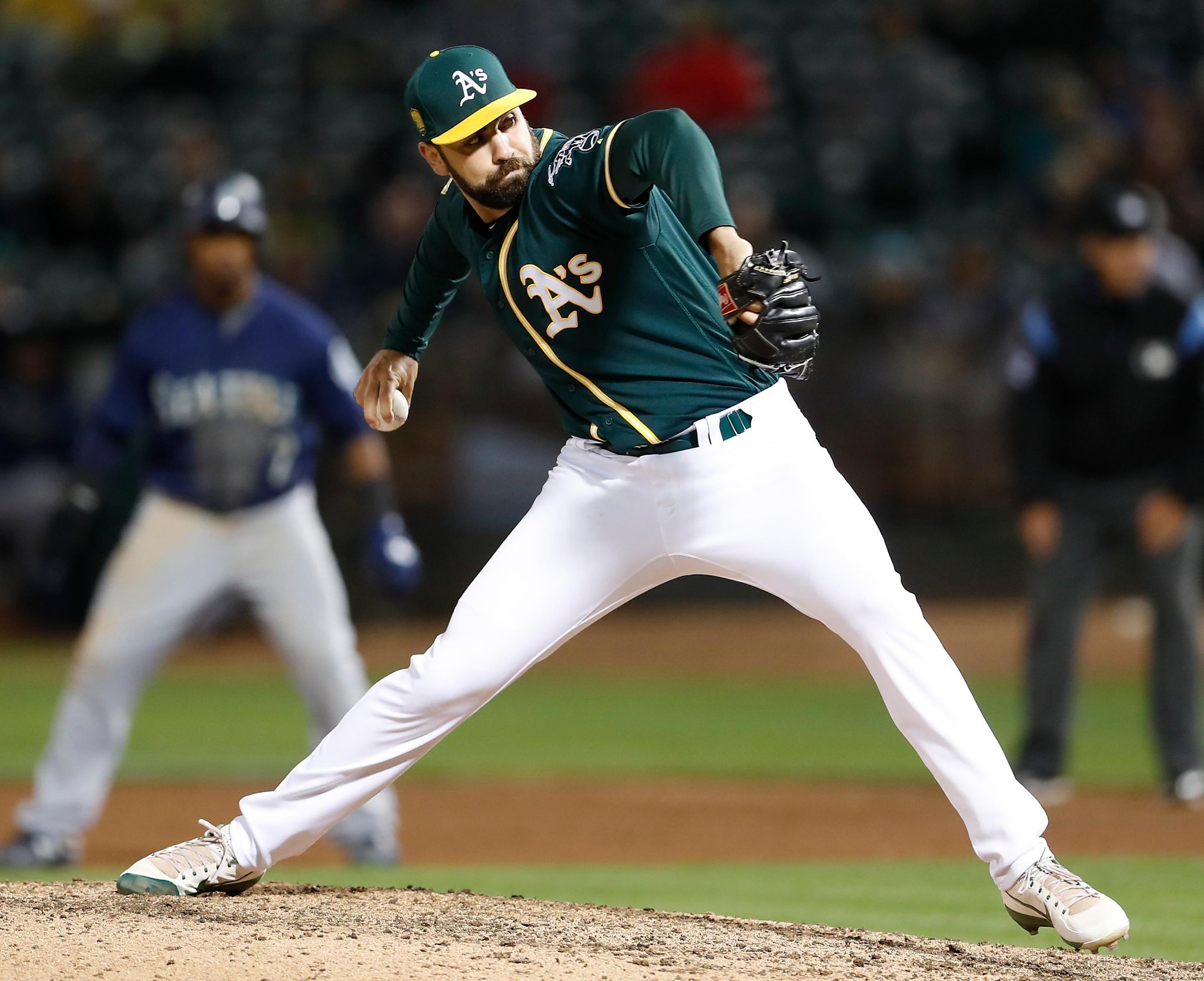 Oakland Athletics relief pitcher Lou Trivino rides the bullpen